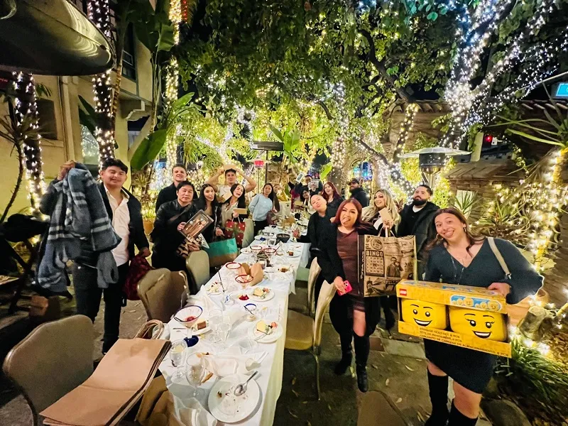 Group photo at Christmas Dinner Party standing and posing